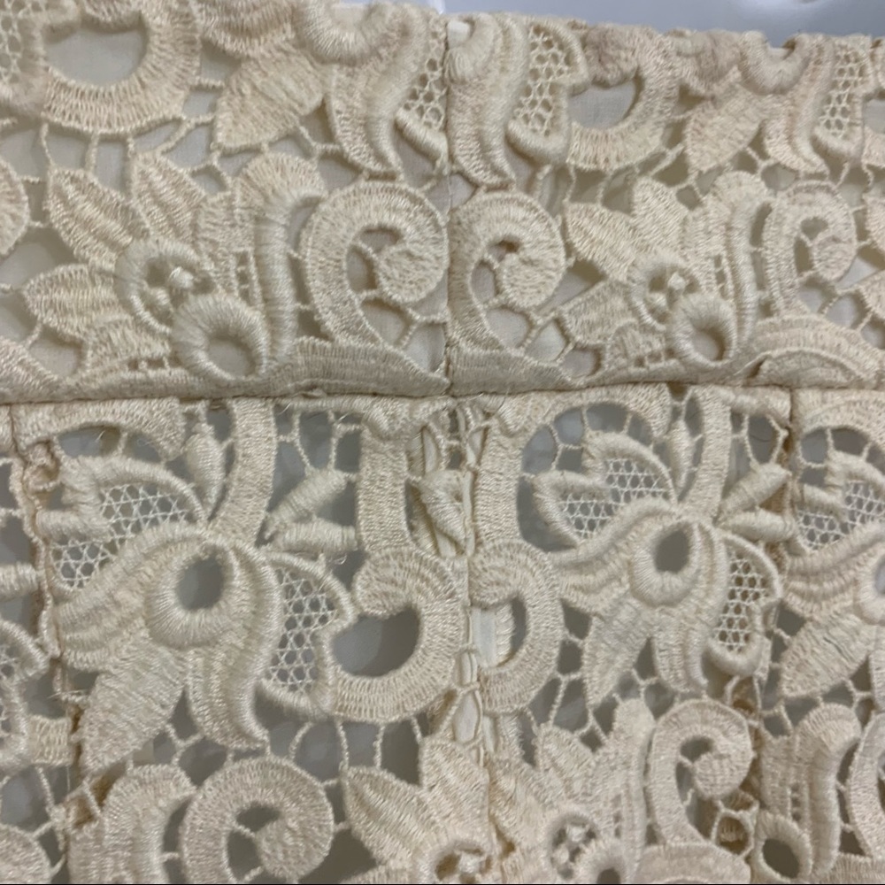 Ivory lace dress by Michael Kors is in like new condition. Size 2 - Picture 11 of 16